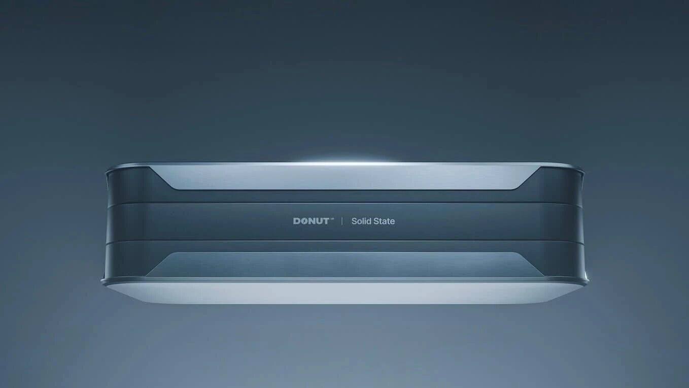 A sleek, rectangular electronic device labeled "DONUT | Solid State" is shown against a plain, gradient blue background, viewed from a slightly lower front angle.